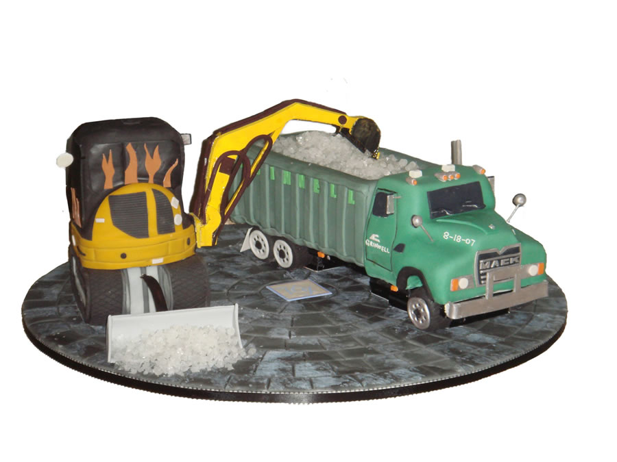 A Grooms Cake and Wedding Cake shaped like Vehicles